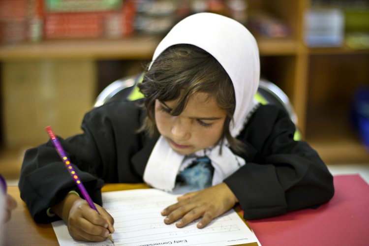 Little girl writing