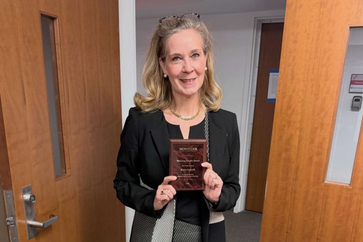 Karen Driscoll holding award received