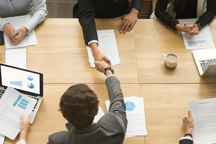 people sitting at a conference table