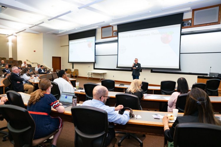 man presenting powerpoint to audience