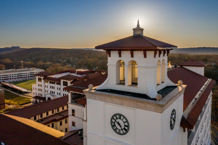 Aerial view of University Hall at sunset