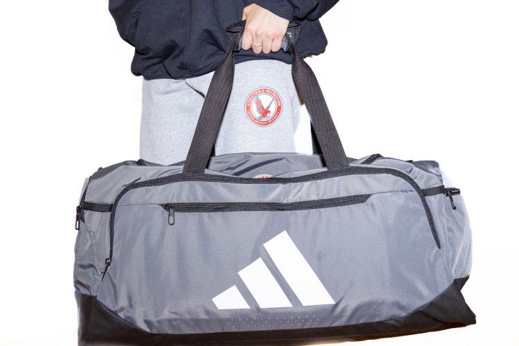photo of a duffle back and sweatpants available for purchase at the rec store