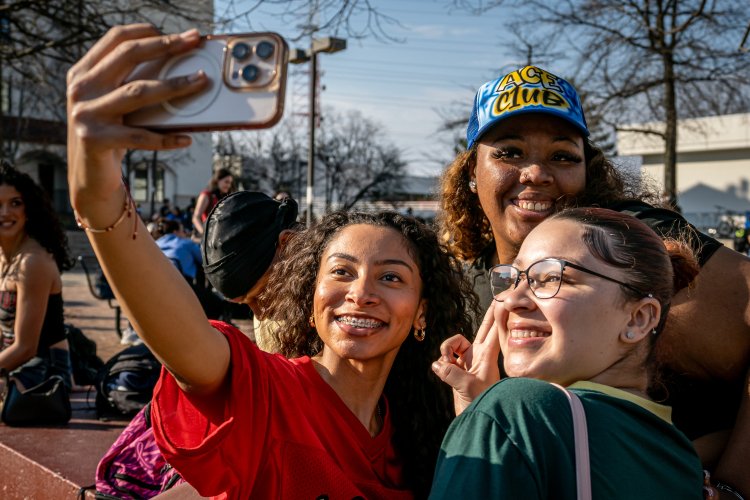 students taking a selfie on the quad