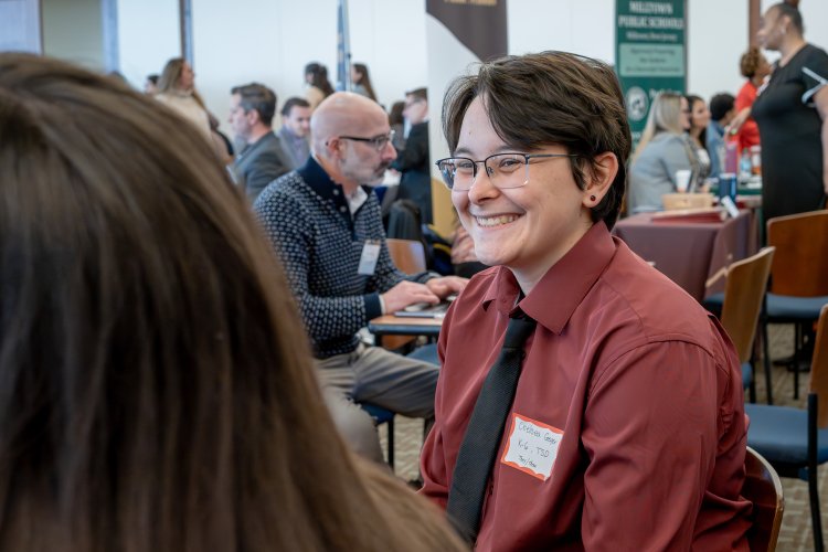 a student smiles as they interview at the Educator's Exchange