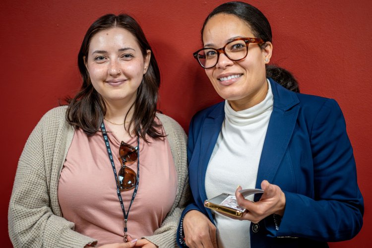 two women colleagues posing for picture