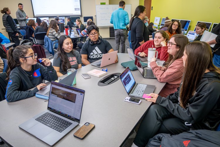 a group of IAC students works together
