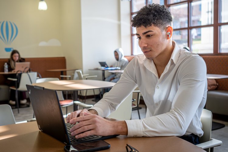 Student works from his laptop