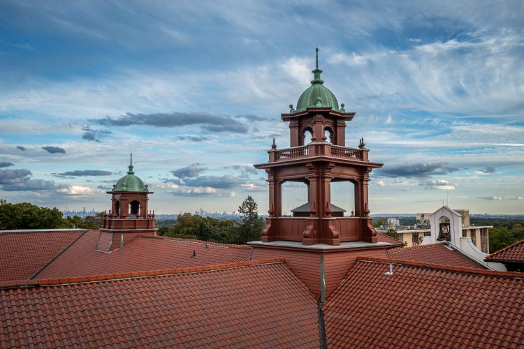 Aerial photograph depicting the roof of Cole Hall and a scenic view of the sky
