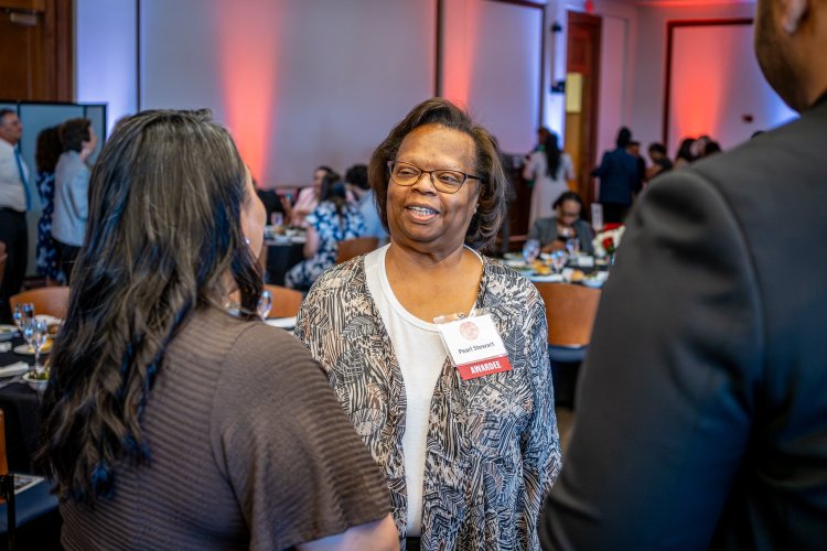 faculty talking at the awards ceremony