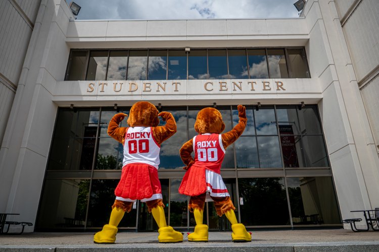 Rocky and Roxy the Red Hawk Mascots showing the back of their jerseys