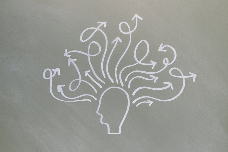 Illustration of a human head with arrows branching out, representing thoughts, ideas