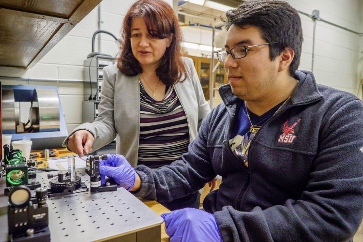 professor working with student on research