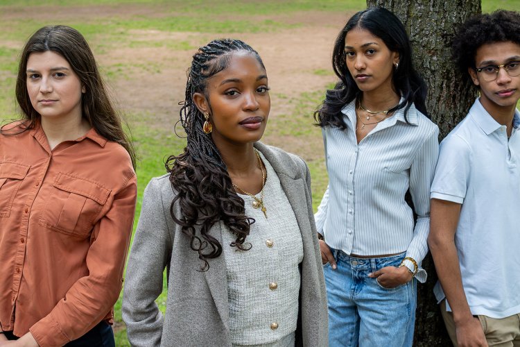 SGA President Leila Jones, stands in foreground, with executive board members, from left, Carmela Beitler, Edlyn Eugene and Danny Gonzalez. Edlyn and Danny are leaning against a tree.