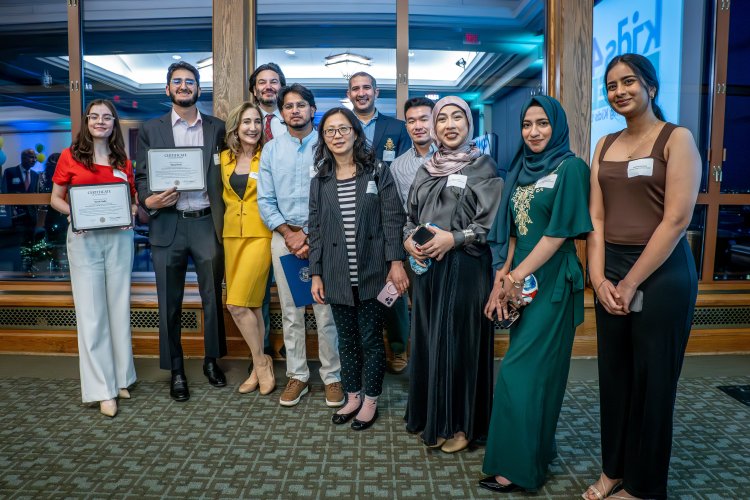 Group of students and professors posing at an event