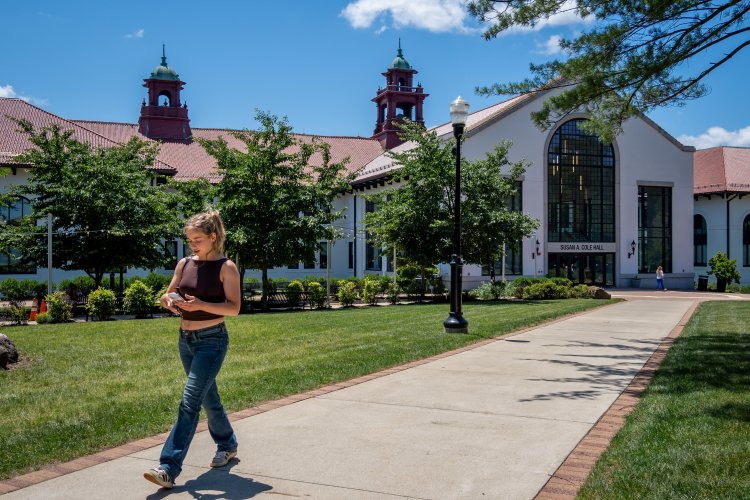 student walking past cole hall