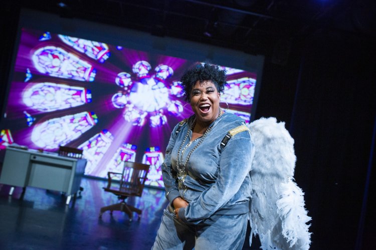 actor on stage wearing wings