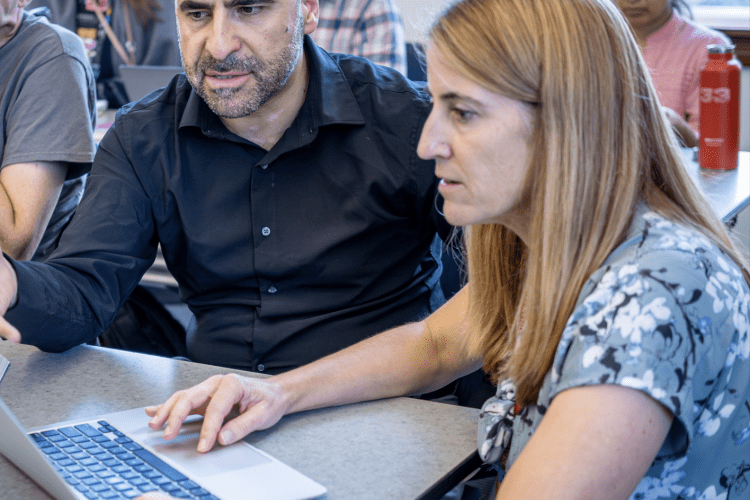image of faculty and faculty developer working together