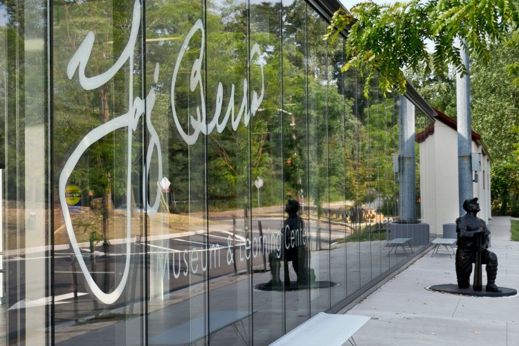 Exterior of Yogi Berra museum. A Yogi Berra statue is infront of it.
