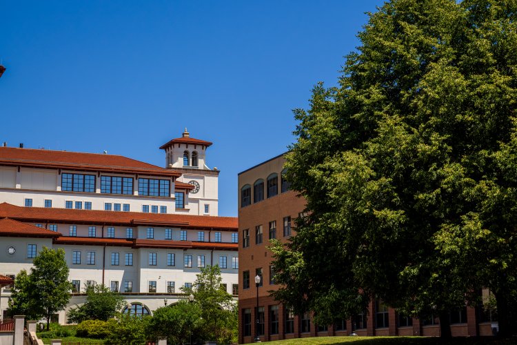 Dickson Hall and Business school with blue skies 