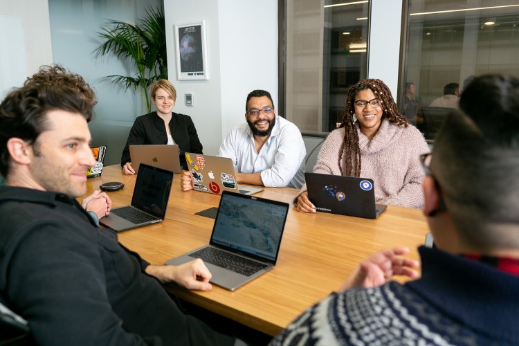 meeting of researchers in a conference room