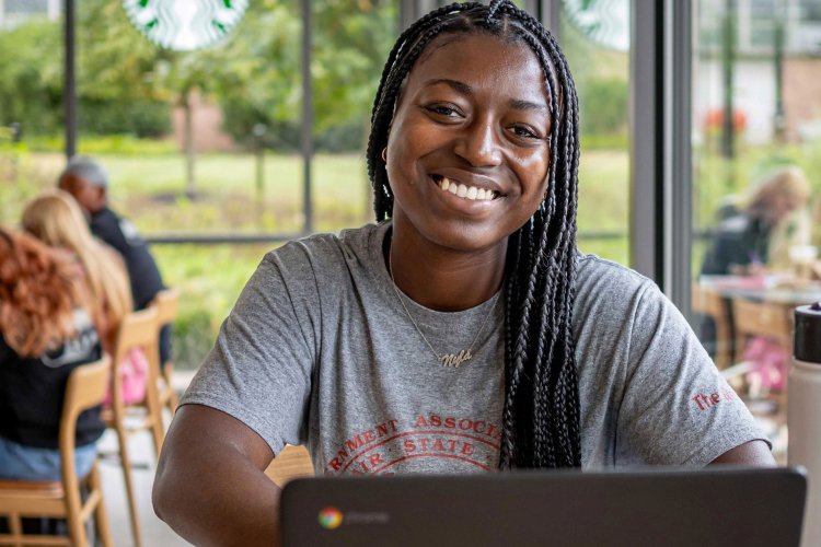 Student using a laptop in a coffee shop