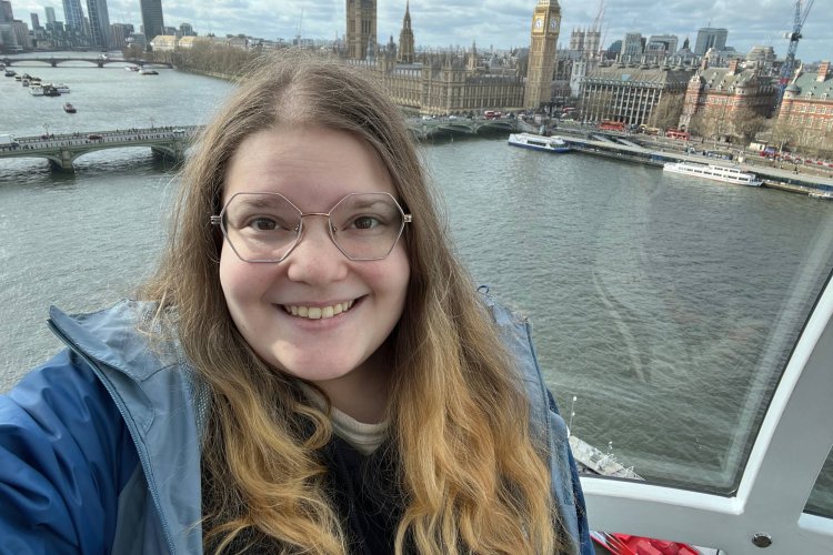 A woman takes a selfie with the British Parliament from the London Eye