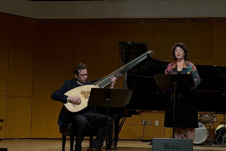 faculty on stage performing