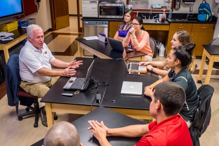 Instructor and students in a classroom