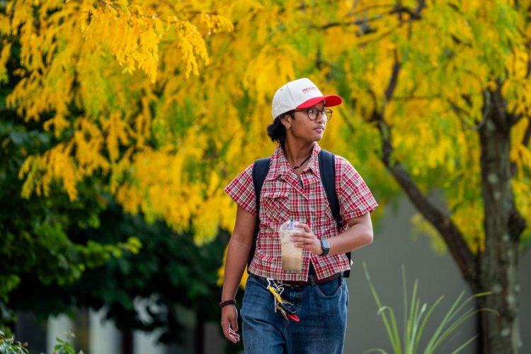 student walking around campus