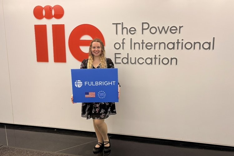 Eveita Meiersone holding sign