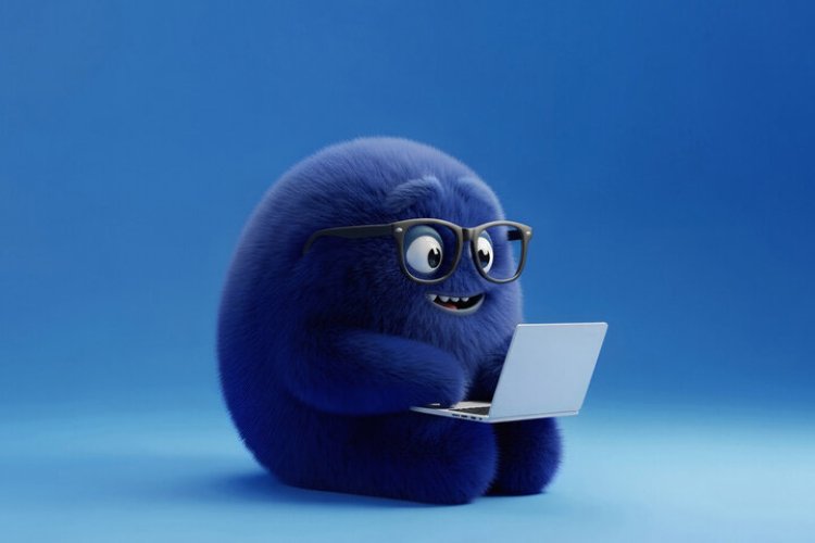 Small cute and purple creature using a laptop