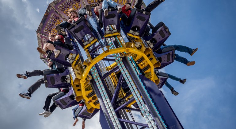 students riding a carnival ride