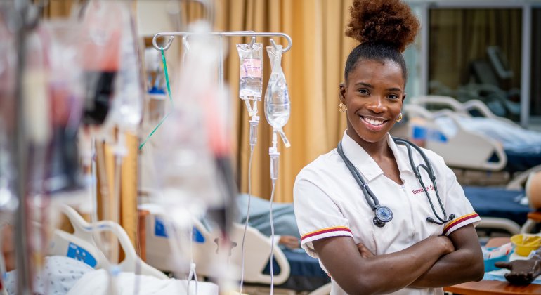 Woman smiling in nursing lab