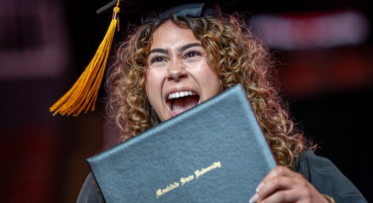 student with diploma