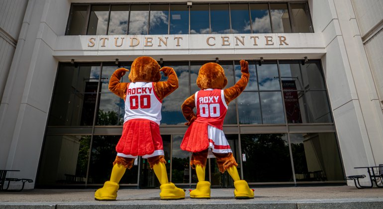Rocky and Roxy the Red Hawk Mascots showing the back of their jerseys