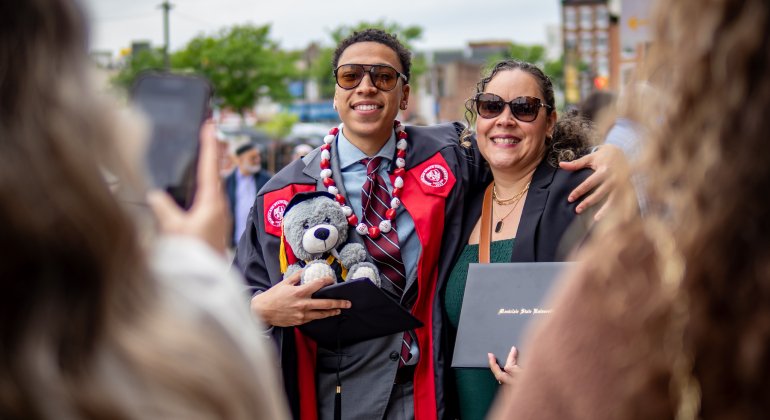Graduate with parent at Commencement
