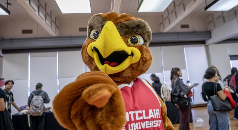 Mascot Rocky pointing at the audience