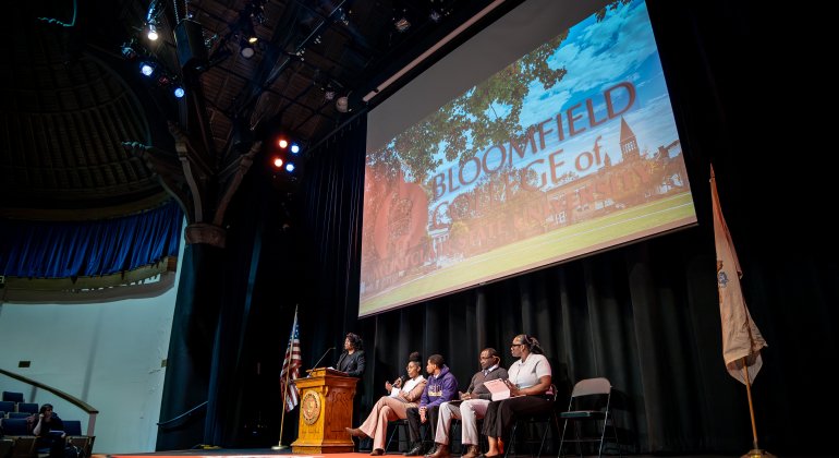 Stage and podium with guest speakers