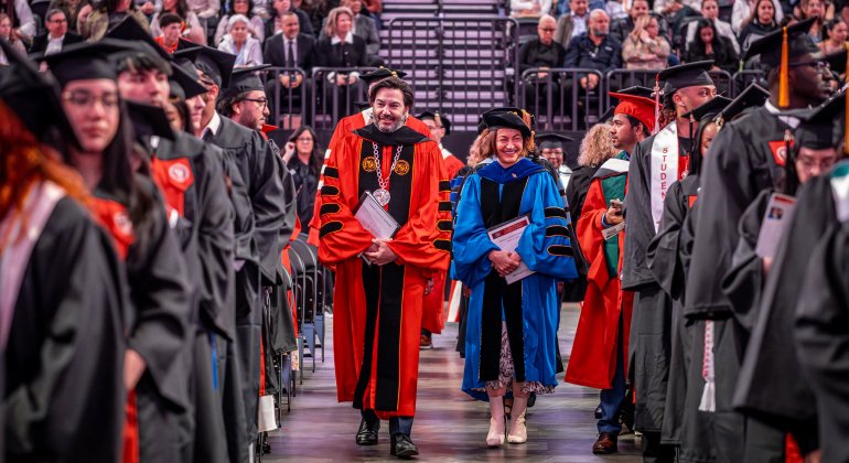 President Koppell and Provost Mili walk down center aisle at Commencement