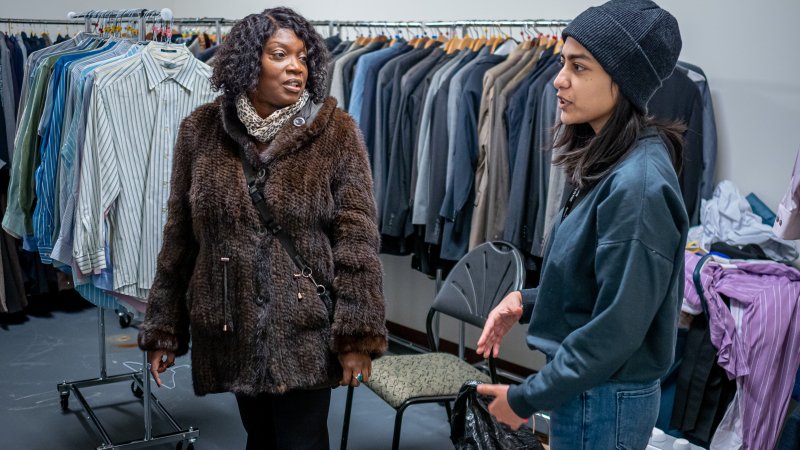 student working at rocky's closet assisting a professional staff
