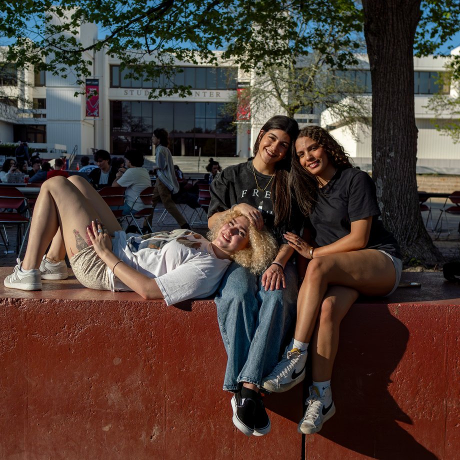 three students on the quad