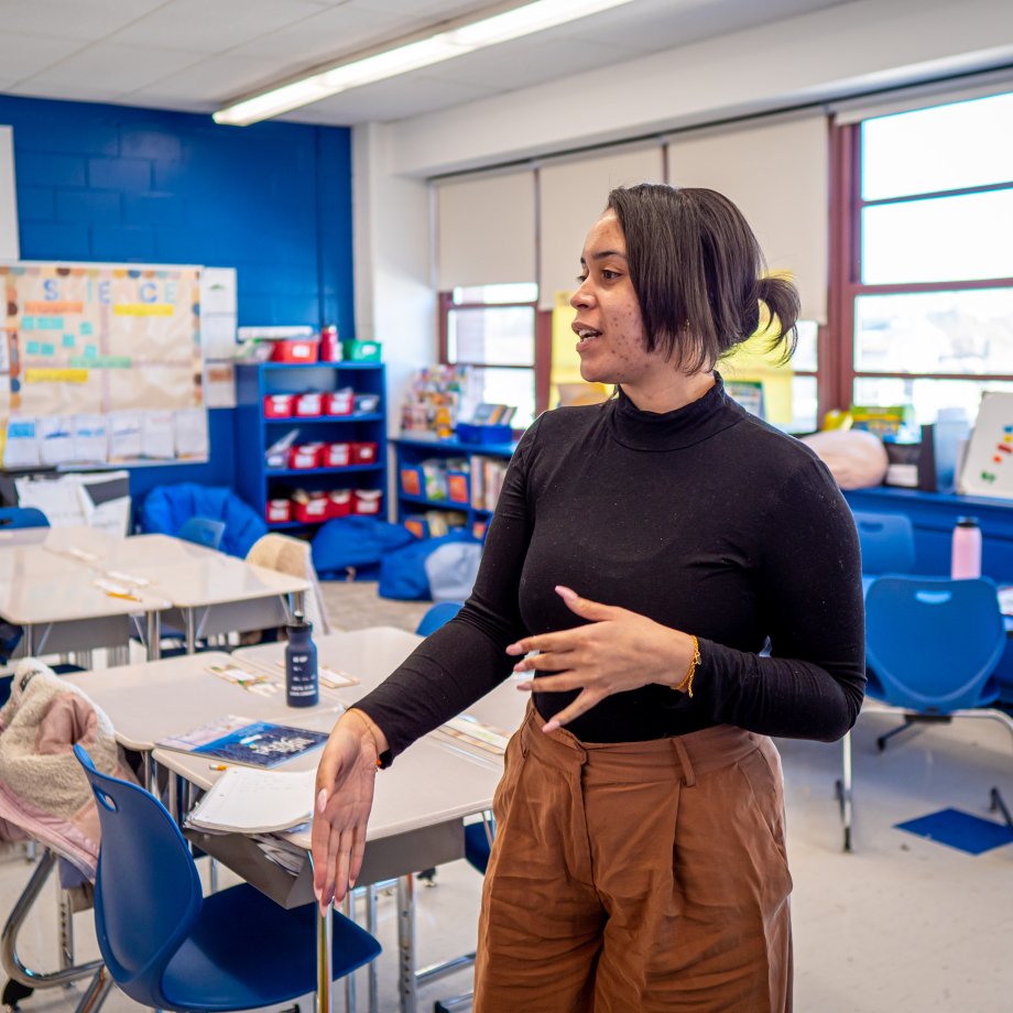 Teacher in classroom speaking