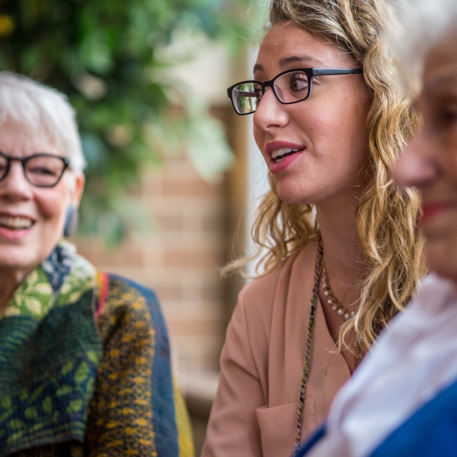 Gerontology student has a discussion with two residents of Cedar Crest