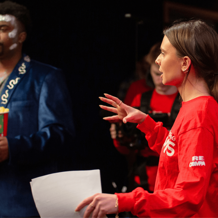 Student directing actors for a scene for a Coca Cola Refreshing film.