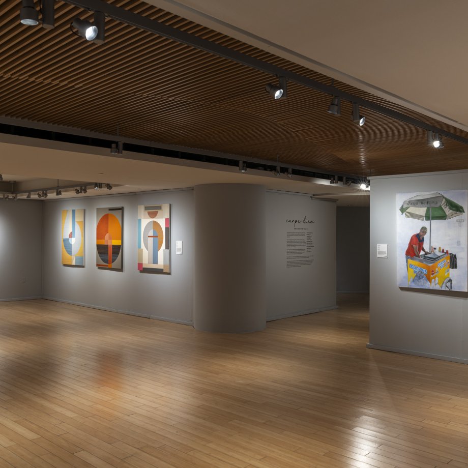 Installation image of art gallery with paintings and drawings hung on various walls.