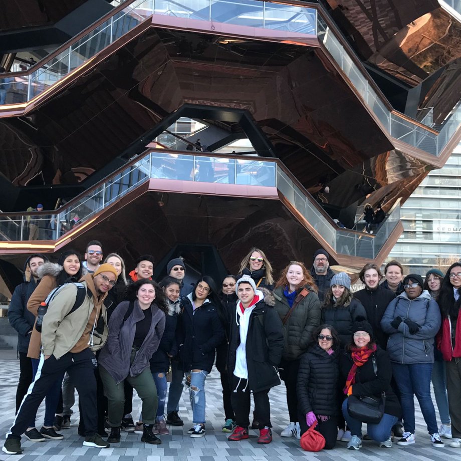 group in NYC outside architectural building