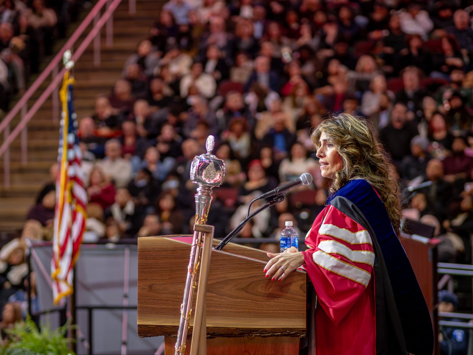 New Jersey State Senator and Senate Majority Leader M. Teresa Ruiz stands at the podium delivering her speech.