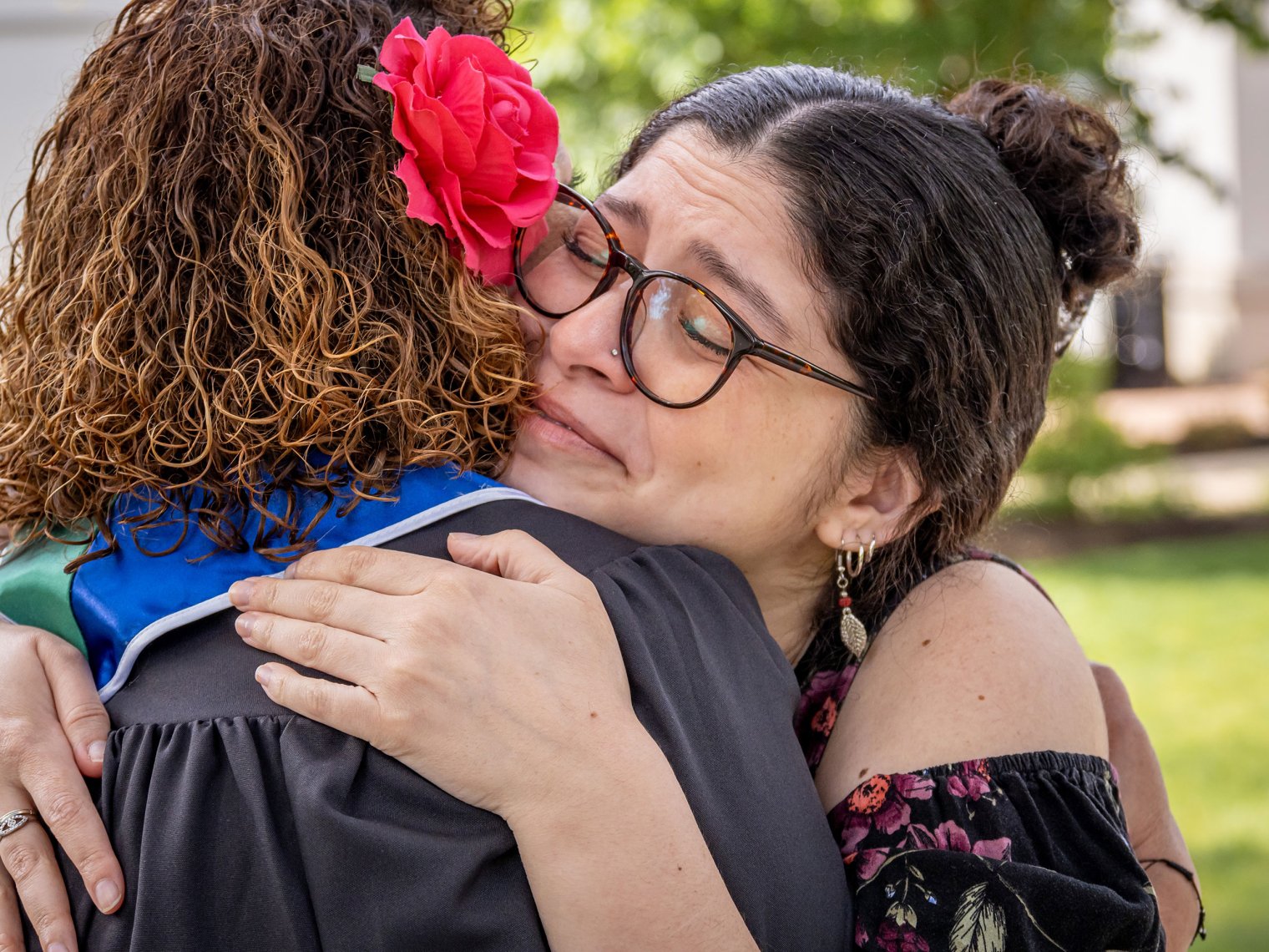 Angel Bernales and her mother Iliana Woodhull embrace.
