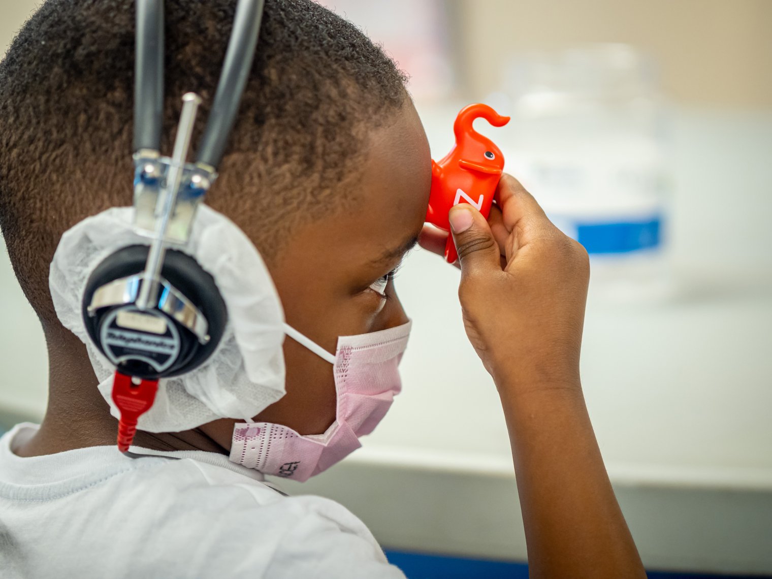 child facing to the side wearing headphones