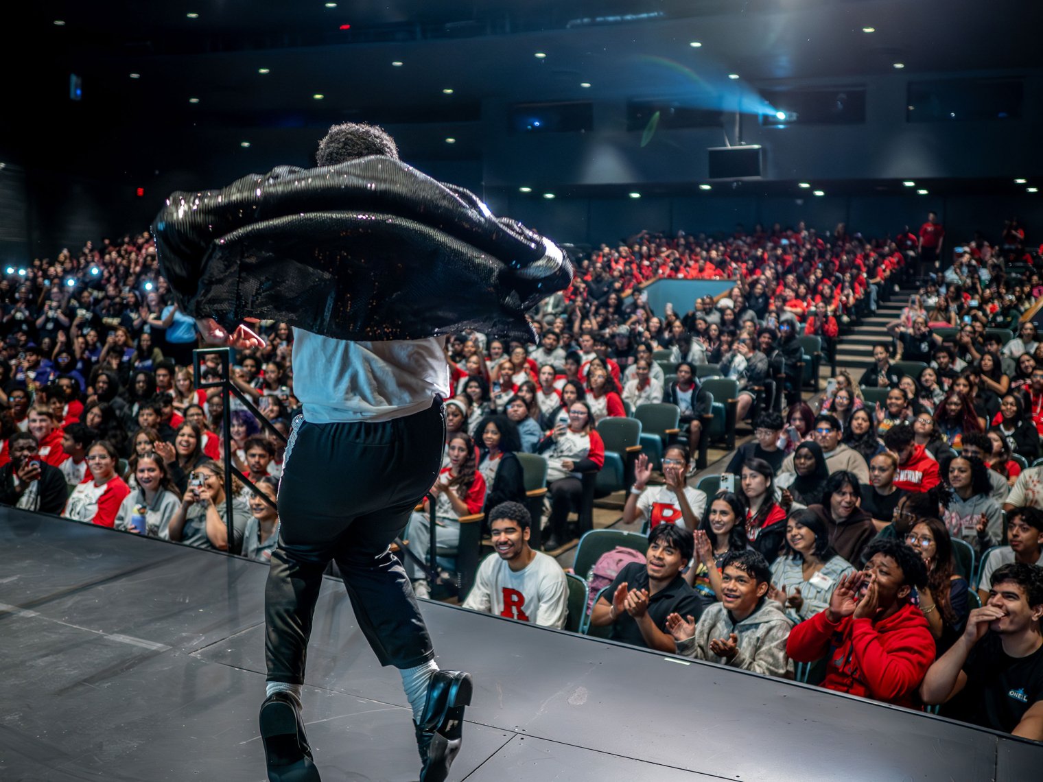 A student dances onstage.